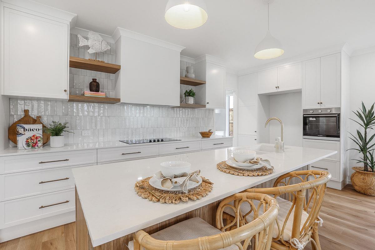 open plan white and hessian textured kitchen