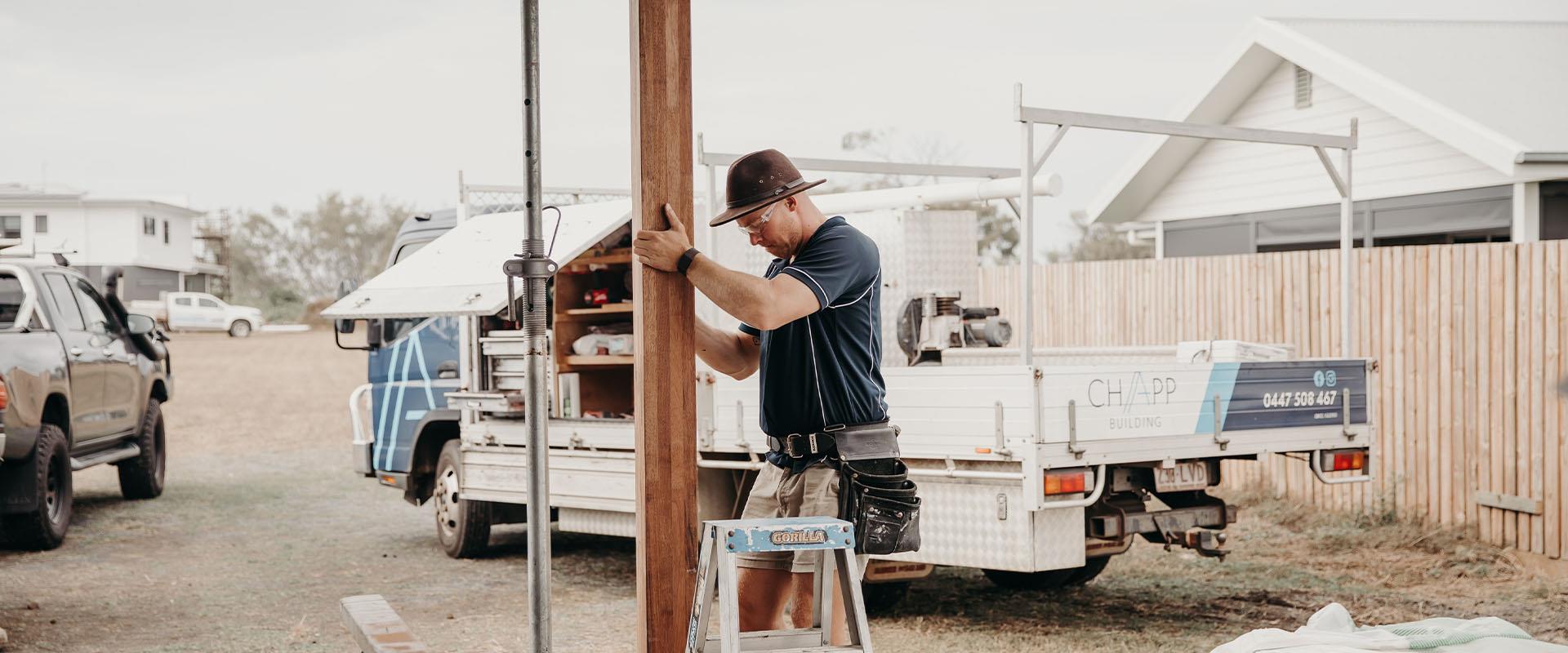 builder working on outdoor posts