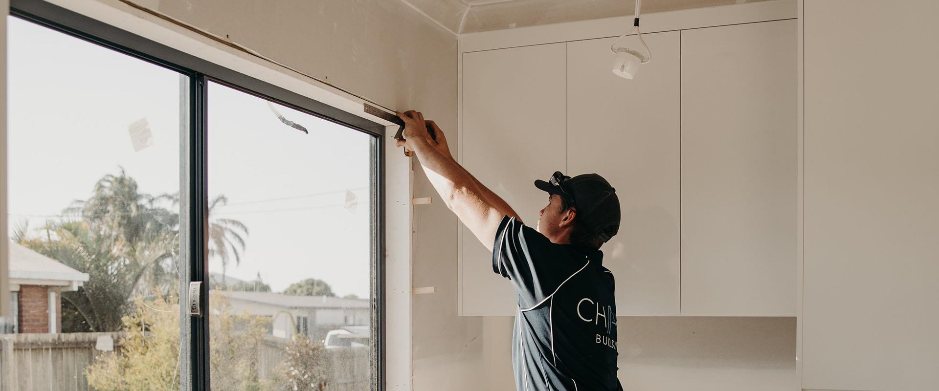 builder measuring top of window